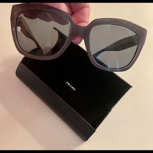 Prada “Polarized” Gray Sunglasses.